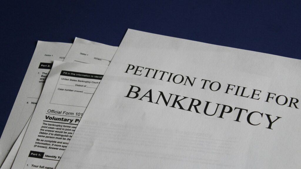 Person holding a petition related to bankruptcy filing