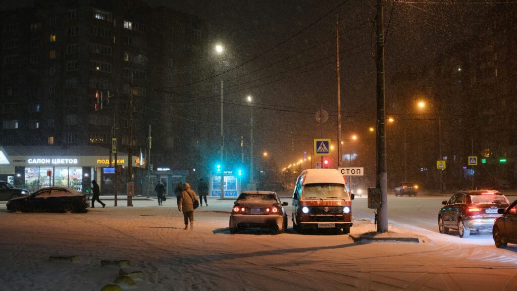 Cars covered in snow during a winter storm