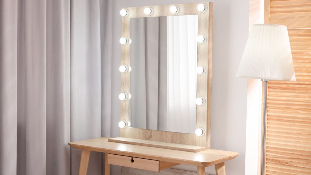 Makeup mirror with bulbs lit along the edges