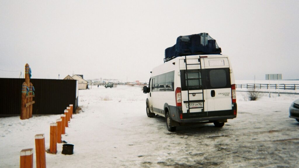 White transport van parked in snow during winter conditions